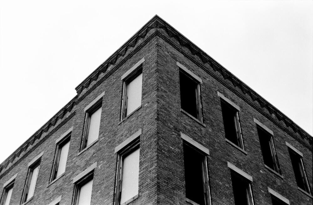 Corner view of abandoned Leatherwear MFR building across the street at 217 Somerset Street. Corner view of abandoned Leatherwear MFR building across the street at 217 Somerset Street.