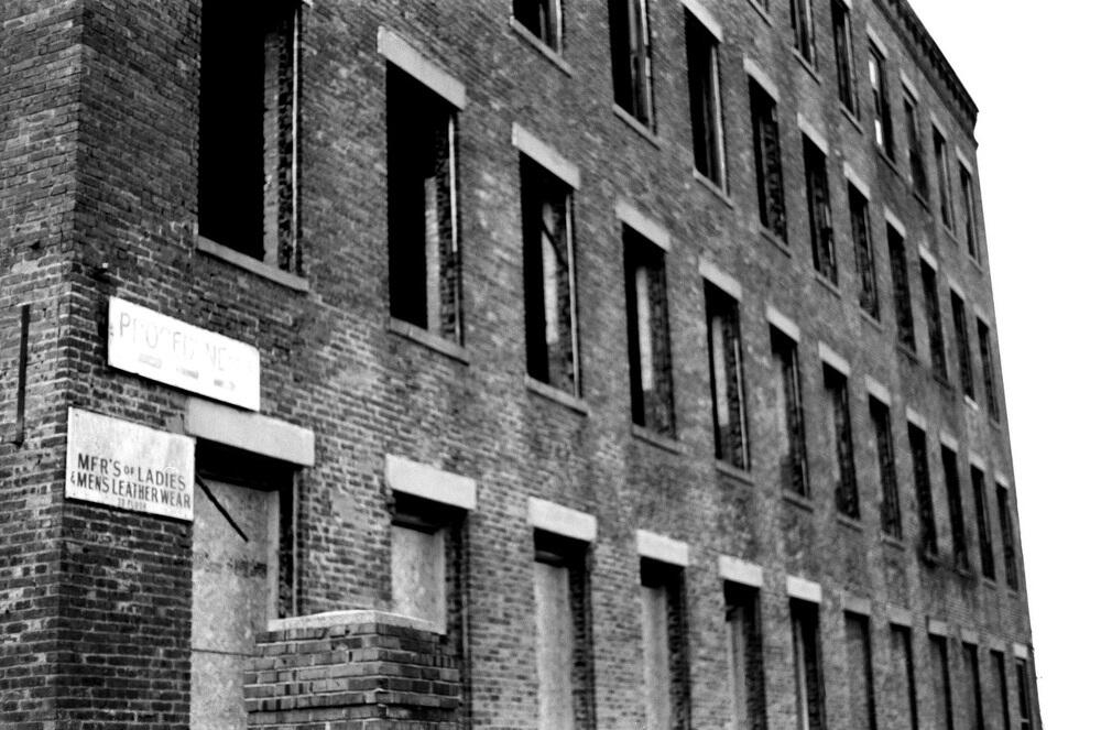Side view of abandoned Leatherwear MFR building across the street at 217 Somerset Street. Side view of abandoned Leatherwear MFR building across the street at 217 Somerset Street.